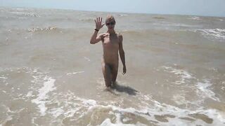 Swimming, splashing and posing naked in the sea...