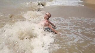 Swimming, splashing and posing naked in the sea...