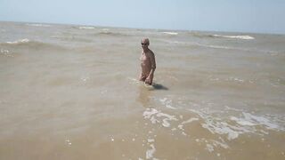 Swimming, splashing and posing naked in the sea...