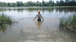 Alexa Cosmic transgirl swimming in clothes in river in jeans shirts and white t-shirt. Alexa Cosmic Wetlook Lover.