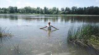 Alexa Cosmic transgirl swimming in clothes in river in jeans shirts and white t-shirt. Alexa Cosmic Wetlook Lover.