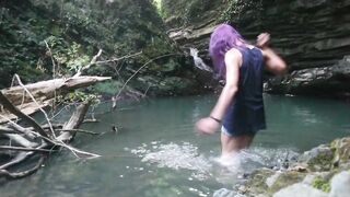 Alexa Cosmic transgirl swimming at waterfall in shirt and t-shirt...