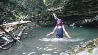 Alexa Cosmic transgirl swimming at waterfall in shirt and t-shirt...